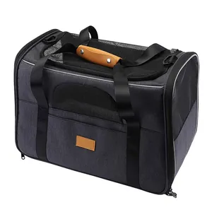 Dark gray foldable pet carrier bag with mesh windows and leather handle detail