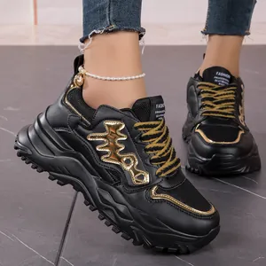 Stylish black and gold fishbone chunky sneakers with breathable mesh upper material