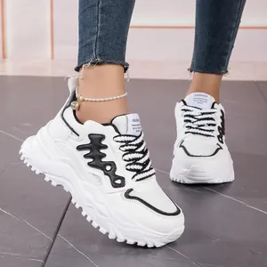 Fashionable women's white fishbone chunky sneakers with breathable mesh panels.