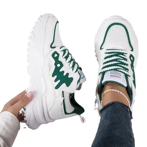 Trendy white and green chunky sneakers with breathable mesh for stylish active women
