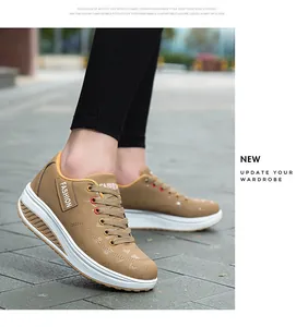 Eleganti sneaker marroni con suola rocker da donna e zeppa alta bianca.