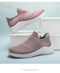 Pair of pink lightweight breathable knit sneakers for casual wear