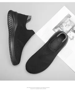 Top-down and side view detail of lightweight black knit socks shoes with EVA sole
