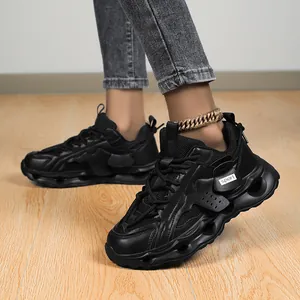 Close-up shot of stylish black chunky sneakers for women featuring hollow-out thick soles