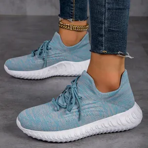 Detail view of lightweight breathable blue flyknit lace-up sneakers for women