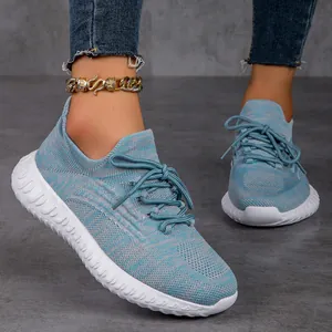Detailed view of women's breathable blue fly-knit lightweight running sneakers