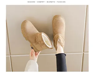 Detailed view of women's camel suede snow boots with thick warm faux fur lining