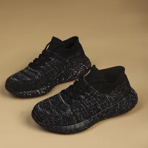 Detail view of lightweight breathable black fly-knit women's running shoes