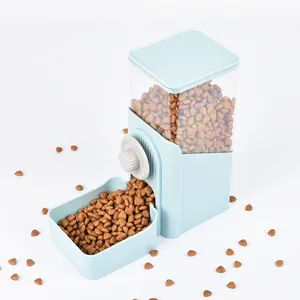 Close-up of a blue automatic pet feeder showing clear food container and bowl