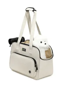 Breathable beige portable pet carrier bag showing a small white dog looking out