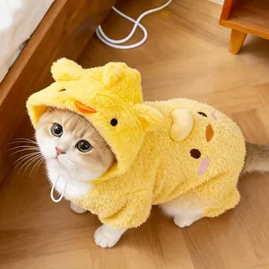 Detailed view of the soft yellow chick cartoon hat worn by a cute cat.
