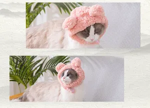 Detailed macro view of a cute pink plush cat hat with fluffy bear ears for pets