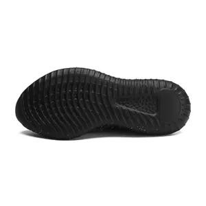 Detailed macro view of the black non-slip rubber outsole of a lightweight running shoe.