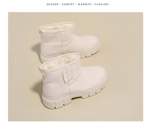 Close-up view of beige winter snow boots with thick plush lining and platform sole