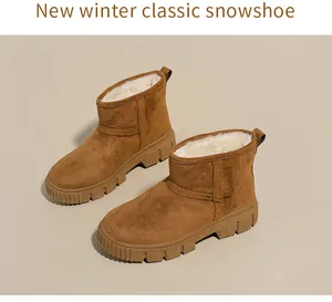 Close-up of brown suede snow boots with thick white faux fur lining and durable non-slip soles.