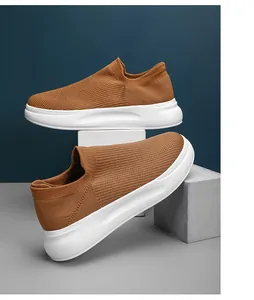 Detailed side view of brown breathable fly-knit slip-on walking sneakers for men