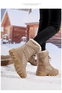 Detail view of khaki women's snow boots with thick fur lining in a snowy winter scene