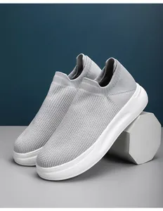 Detailed view of grey breathable fly-knit slip-on men's casual outdoor sneakers