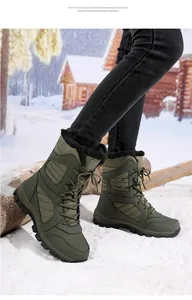 Detailed view of olive green women's winter snow boots with warm lining on snow