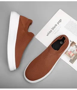 Close-up of brown breathable knit slip-on casual shoes for men with thick white sole