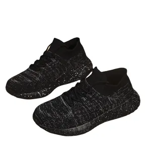 Lightweight breathable black fly-knit sneakers for women with white speckled soles