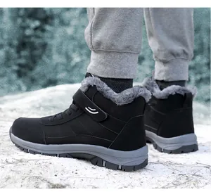Detail view of black high-top outdoor winter boots with warm grey faux fur lining