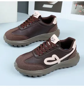 Retro brown sneakers with embroidered heart detail and platform sole for women