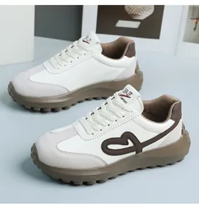 Retro style women's thick sole sneakers featuring brown heart embroidery and nonslip design
