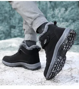 Close-up detail of black fleece-lined winter snow boots with anti-slip thick sole