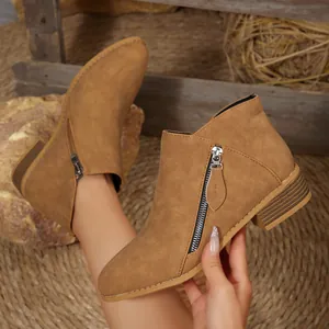 Chic women's tan pointed toe ankle boots featuring chunky heel and side zipper detail