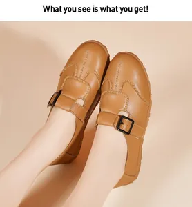 Detailansicht der braunen Vintage-Slipper für Damen mit verstellbarer Metallschnalle