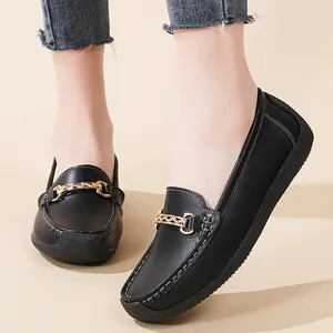 Classic black women's casual flat loafers with soft soles and gold chain buckle detail