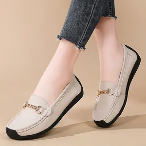 Comfortable beige leather loafers for women with gold chain detail and soft sole