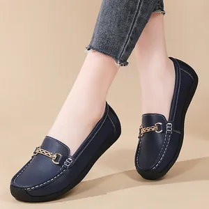 Classic navy blue loafers for women with soft sole and gold metal chain detail