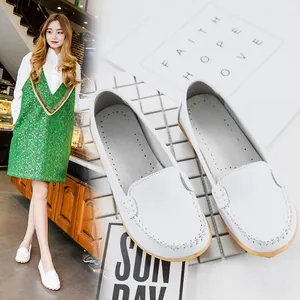 Detailed view of white genuine leather loafers for women with a comfortable flat sole