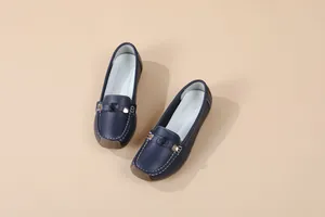 Stylish navy blue women's leather loafers with white stitching and soft rubber sole