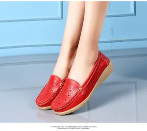 Close-up of red leather hollow-out loafers with comfortable wedge soles for women