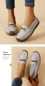 Detailed macro view of comfortable grey leather loafers for women with soft flexible soles