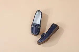 Dark blue women's casual loafers featuring soft soles and contrast white stitching