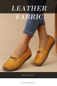 Detail view of yellow leather loafers worn by a model for soft comfortable walking
