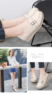 Detail view of beige platform wedge loafers with metal buckles worn by a model