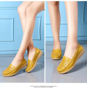 Detail view of yellow hollow-out leather loafers for women with soft wedge soles