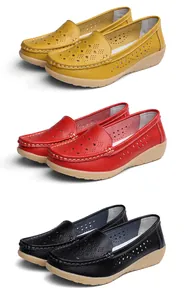 Detail of breathable hollow out leather loafers for women in red, yellow and black.