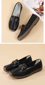 Comfortable black loafers for women with soft sole and elegant gold buckle detail