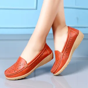 Soft orange wedge loafers for women featuring a breathable hollow-out floral design