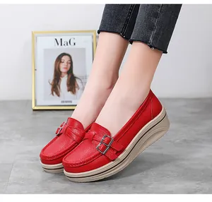Elegant red platform wedge loafers for women featuring a stylish metal buckle detail