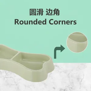 Cuenco doble para mascotas con forma de hueso, verde menta y bordes redondeados de seguridad.