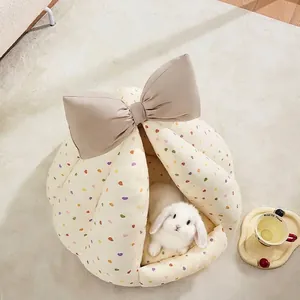 Semi-enclosed rabbit bed house with large bow and heart pattern