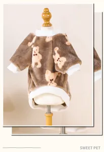 Detailed view of a cozy brown flannel pet sweater featuring cute cartoon bear patterns