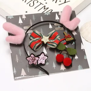 Festive Christmas hair accessory set featuring pink plush antlers and red striped bow